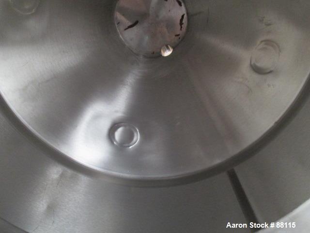 Used Tank, 20 Gallon, Stainless Steel, Vertical. 21" Diameter x 11" straight side x 12" coned bottom, flat top. 1" off center bottom outlet. Mounted on 4 legs with casters.