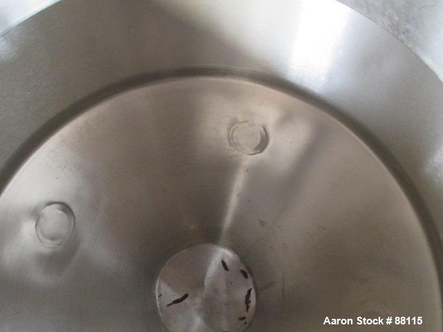 Used Tank, 20 Gallon, Stainless Steel, Vertical. 21" Diameter x 11" straight side x 12" coned bottom, flat top. 1" off center bottom outlet. Mounted on 4 legs with casters.