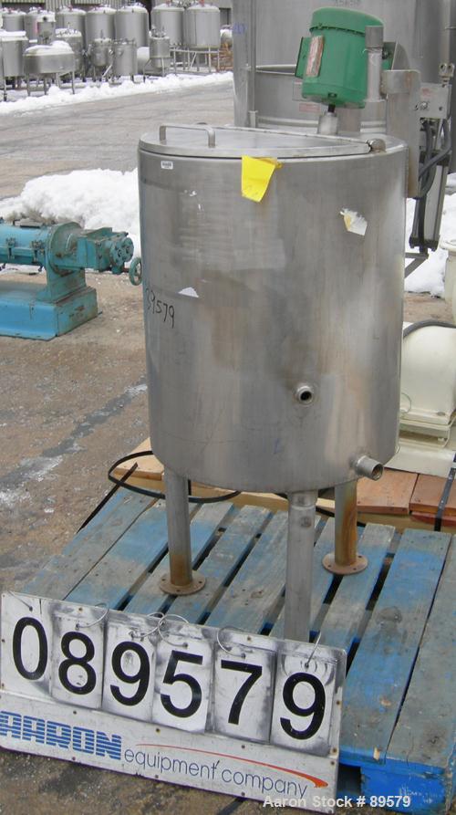 USED: Tank, 55 gallon, 304 stainless steel, vertical. 24" diameter x 29" straight side. Flat top with a 1/2 hinged cover, slight coned bottom. Clamp-on agitator, 3/4" diameter shaft with a 3 blade tu...