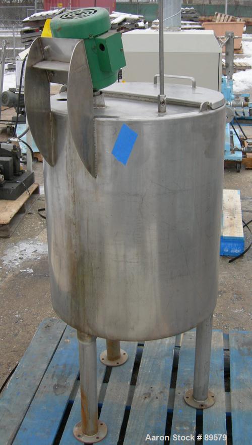 USED: Tank, 55 gallon, 304 stainless steel, vertical. 24" diameter x 29" straight side. Flat top with a 1/2 hinged cover, slight coned bottom. Clamp-on agitator, 3/4" diameter shaft with a 3 blade tu...