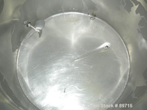 USED: Tank, 225 gallon, 304 stainless steel, vertical. 38" diameter x 48" straight side, open top with cover, flat bottom. Approximate 1" off center bottom outlet. Side bottom 3 blade agitator, drive...