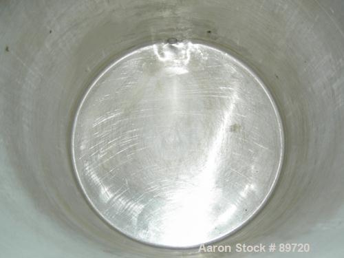 USED: Tank, 55 gallon, 304 stainless steel, vertical. 22" diameter x 35" straight side, open top, no cover, flat bottom. Approximate 1" side bottom outlet. Mounted on 4 carbon steel legs with casters...