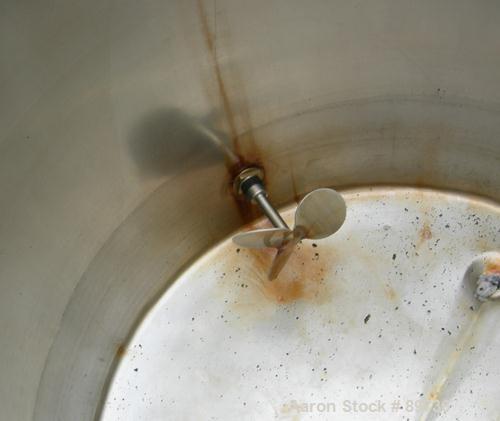 USED: Tank, 225 gallon, 304 stainless steel, vertical. 38" diameter x 48" straight side, open top, no cover, flat bottom. Approximate 1" off center bottom outlet, side bottom 3 blade agitator, driven...