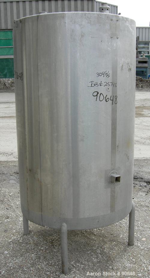 USED: Tank, 290 gallon, 304 stainless steel, vertical. Approximate38" diameter x 60" straight side. Flat top, sloped bottom. Openings:top (2) 1-1/2" tri clamp, (2) 2" tri clamp, 17-1/2" manway with c...