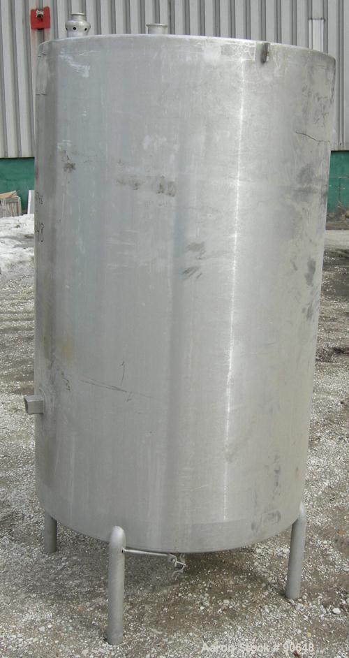 USED: Tank, 290 gallon, 304 stainless steel, vertical. Approximate38" diameter x 60" straight side. Flat top, sloped bottom. Openings:top (2) 1-1/2" tri clamp, (2) 2" tri clamp, 17-1/2" manway with c...