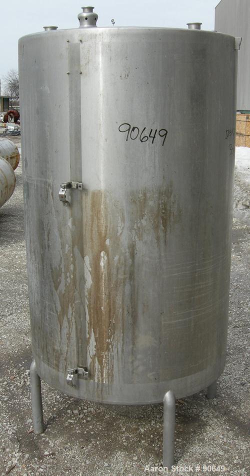 USED: Tank, 290 gallon, 304 stainless steel, vertical. Approximate38" diameter x 60" straight side. Flat top, sloped bottom. Openings:top (2) 1-1/2" tri clamp, (2) 2" tri clamp, 17-1/2" manway with c...