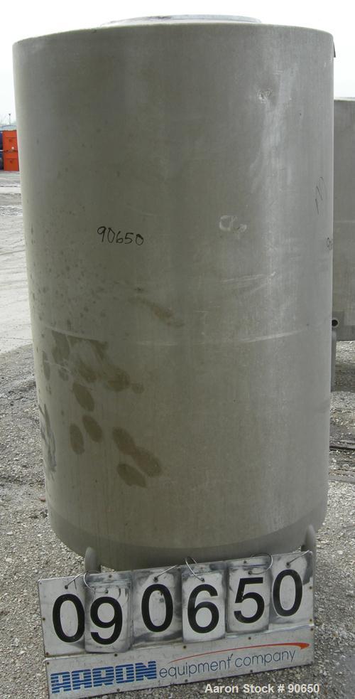 USED: Tank, 290 gallon, 304 stainless steel, vertical. Approximate38" diameer x 60" straight side. Flat top, sloped bottom. Openings:top (2) 1-1/2" tri clamp, (2) 2" tri clamp, 17-1/2" manway with co...