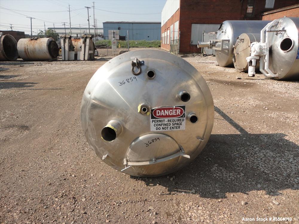 Used APV Crepaco Tank, 330 Gallon, Stainless Steel. Approximately 48" diameter x 42" straight side, dish top, flat bottom, rated 0.722 psi at 250 f internal, 18" man way, 6", (4)3" top nozzles, 4" si...
