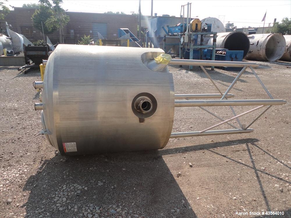Used APV Crepaco Tank, 330 Gallon, Stainless Steel. Approximately 48" diameter x 42" straight side, dish top, flat bottom, rated 0.722 psi at 250 f internal, 18" man way, 6", (4)3" top nozzles, 4" si...