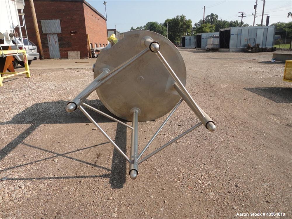 Used APV Crepaco Tank, 330 Gallon, Stainless Steel. Approximately 48" diameter x 42" straight side, dish top, flat bottom, rated 0.722 psi at 250 f internal, 18" man way, 6", (4)3" top nozzles, 4" si...