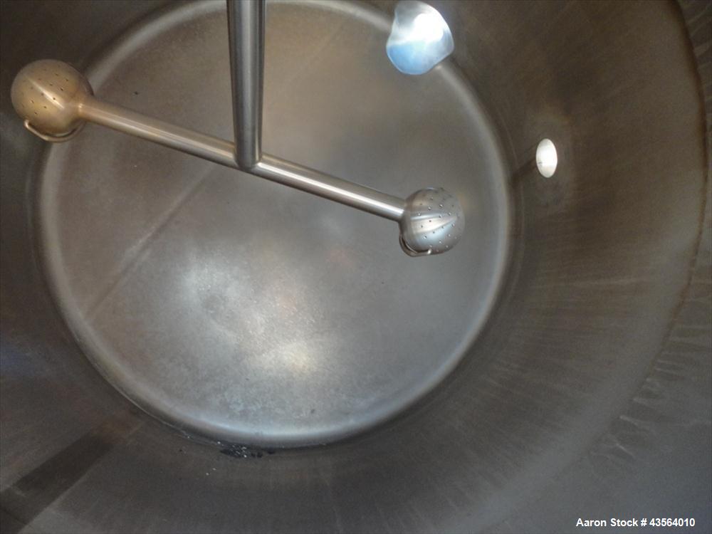Used APV Crepaco Tank, 330 Gallon, Stainless Steel. Approximately 48" diameter x 42" straight side, dish top, flat bottom, rated 0.722 psi at 250 f internal, 18" man way, 6", (4)3" top nozzles, 4" si...
