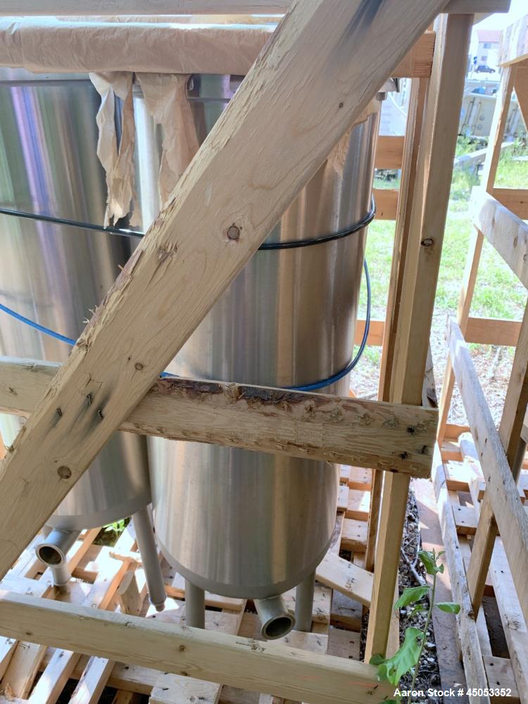 UNUSED- APV Crepaco 20 Gallon Single Wall Stainless Steel Tank. Has 2.5" sprayball with a 270 degree pattern at up to 40 gpm. Tanks are 304 stainless steel with #4 finish with welds stripe bead glass...
