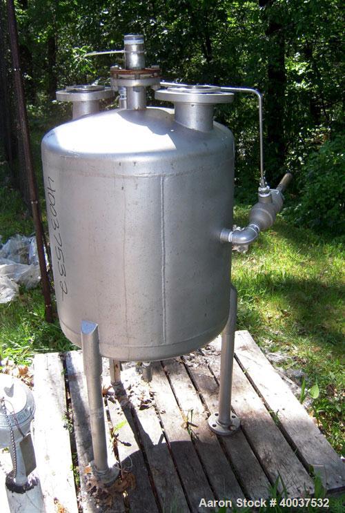 Used Acme Industrial Pressure Tank, 50 gallon, stainless steel, vertical. 24" diameter x 24" straight side, dished top and bottom. Internal rated FV/15 psi at 100 deg.f.. Openings top 2", 3", 4". Sid...