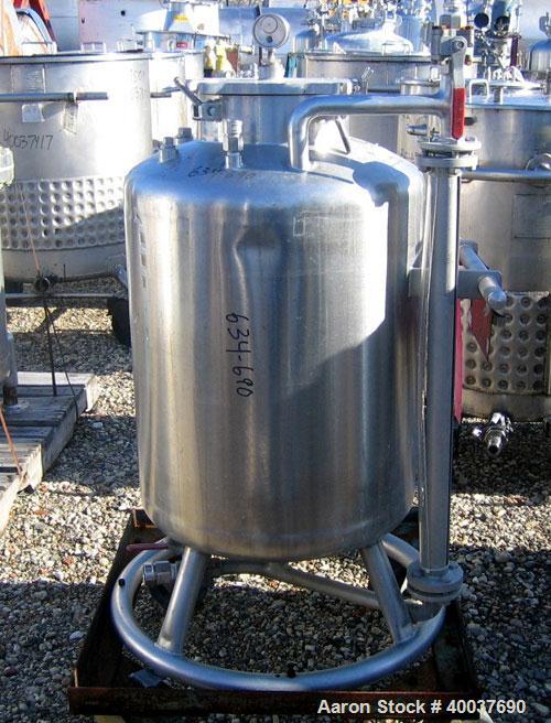 Used Acme Pressure Tank, 40 gallon, Stainless steel, Vertical. 22" diameter x 24" straight side, dished top and bottom. Internal rated 100/fv at 325 deg.f.. Openings top 10". 1" center bottom outlet....