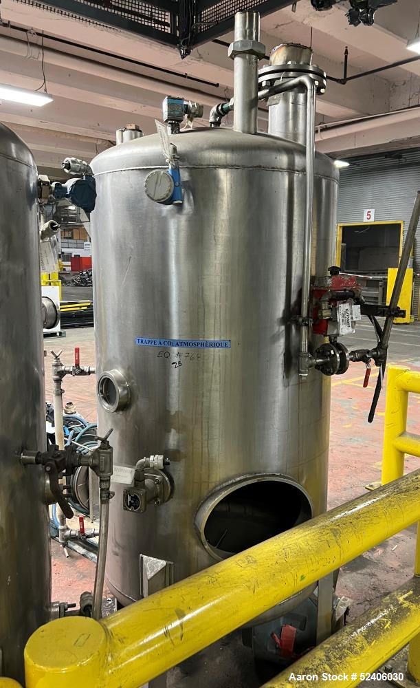Used Alpha Stainless Tank, Approximate 250 Gallon, Stainless Steel, Vertical. Approximate 36" diameter x 57" straight side, dished top & bottom. Mounted on 4 stainless legs.