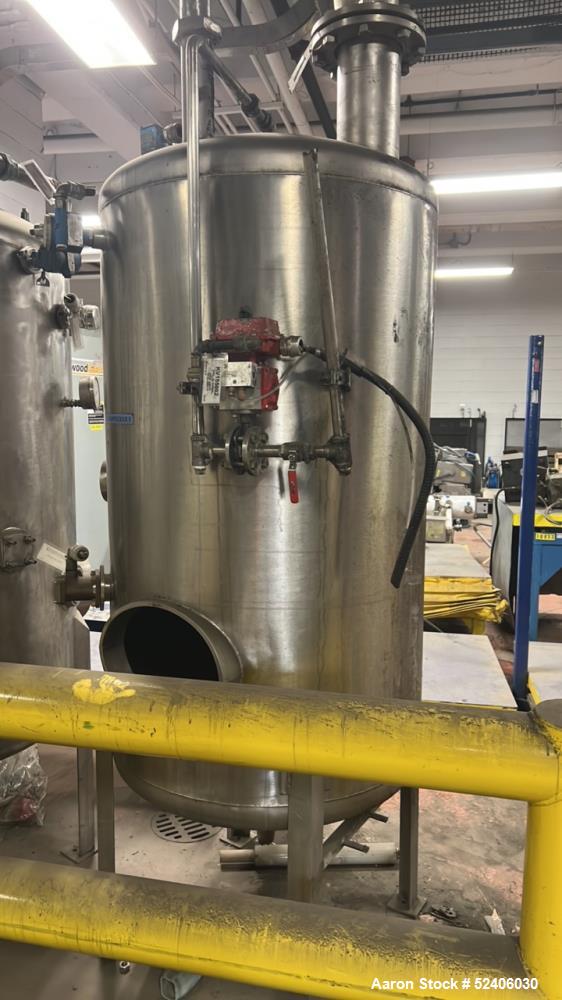 Used Alpha Stainless Tank, Approximate 250 Gallon, Stainless Steel, Vertical. Approximate 36" diameter x 57" straight side, dished top & bottom. Mounted on 4 stainless legs.
