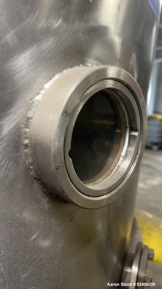 Used Alpha Stainless Tank, Approximate 250 Gallon, Stainless Steel, Vertical. Approximate 36" diameter x 57" straight side, dished top & bottom. Mounted on 4 stainless legs.