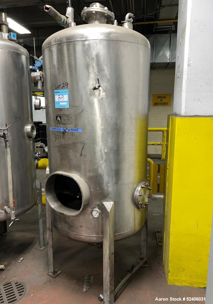 Used Alpha Stainless Tank, Approximate 250 Gallon, Stainless Steel, Vertical. Approximate 36" diameter x 57" straight side, dished top & bottom. Mounted on 4 stainless legs.