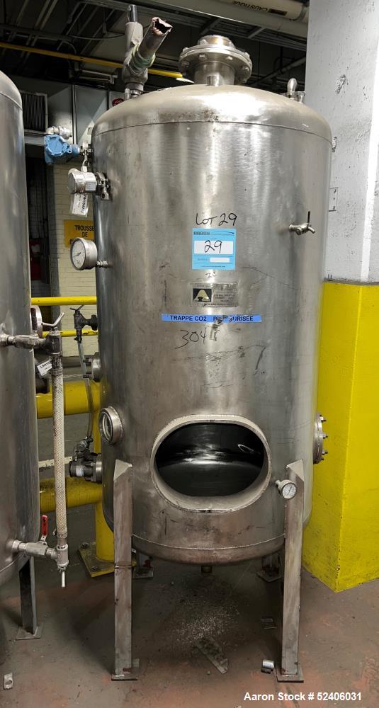 Used Alpha Stainless Tank, Approximate 250 Gallon, Stainless Steel, Vertical. Approximate 36" diameter x 57" straight side, dished top & bottom. Mounted on 4 stainless legs.