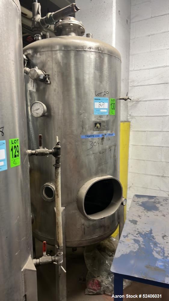 Used Alpha Stainless Tank, Approximate 250 Gallon, Stainless Steel, Vertical. Approximate 36" diameter x 57" straight side, dished top & bottom. Mounted on 4 stainless legs.