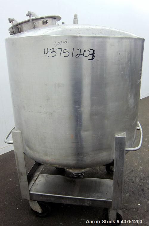 Used C.E. Howard Tank, 335 Gallon, 304 Stainless Steel, Vertical. 48" Diameter x 36" straight side. Dished top, coned bottom. Openings top 16" man way with cover. Approximate 4" center bottom outlet....