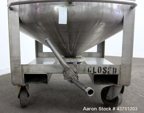 Used C.E. Howard Tank, 335 Gallon, 304 Stainless Steel, Vertical. 48" Diameter x 36" straight side. Dished top, coned bottom. Openings top 16" man way with cover. Approximate 4" center bottom outlet....