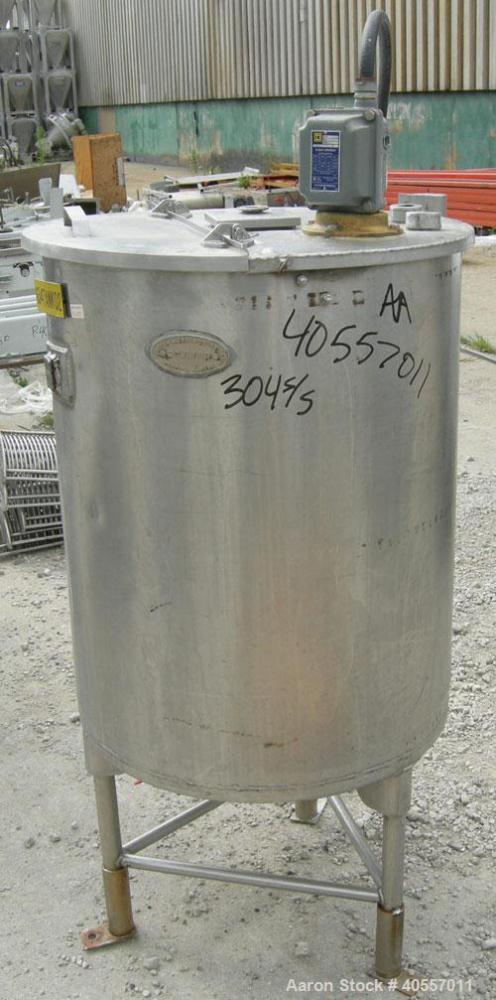 Used Coulter Tank, 75 gallon, 304 stainless steel, vertical. 26" diameter x 32" straight side, open top a 1 piece 1/3 hinged cover, coned bottom. Includes a shaft with a 3 blade prop, no drive. Appro...