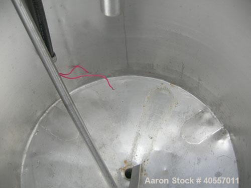 Used Coulter Tank, 75 gallon, 304 stainless steel, vertical. 26" diameter x 32" straight side, open top a 1 piece 1/3 hinged cover, coned bottom. Includes a shaft with a 3 blade prop, no drive. Appro...
