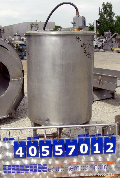 Used Coulter tank, 75 gallon, 304 stainless steel, vertical. 26" diameter x 32" straight side, open top a 1 piece 1/3 hinged cover, coned bottom. Includes a shaft with a 3 blade prop, no drive. Appro...