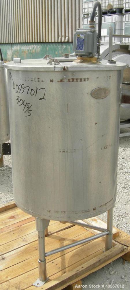 Used Coulter tank, 75 gallon, 304 stainless steel, vertical. 26" diameter x 32" straight side, open top a 1 piece 1/3 hinged cover, coned bottom. Includes a shaft with a 3 blade prop, no drive. Appro...