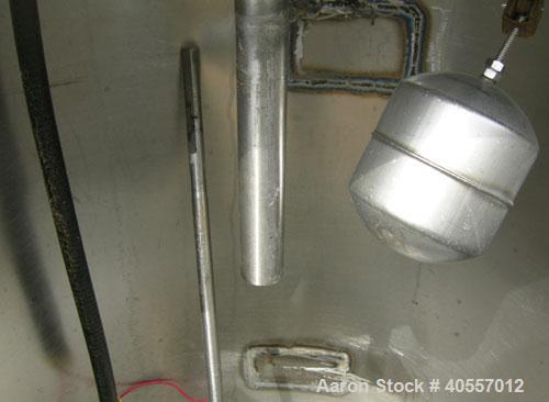 Used Coulter tank, 75 gallon, 304 stainless steel, vertical. 26" diameter x 32" straight side, open top a 1 piece 1/3 hinged cover, coned bottom. Includes a shaft with a 3 blade prop, no drive. Appro...