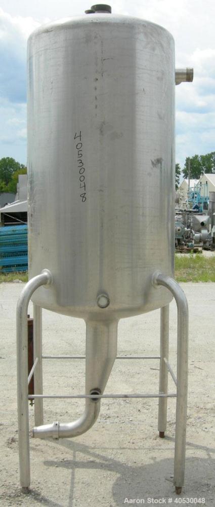 Used Creamery Package Tank, 250 gallon, 304 stainless steel, vertical. Approximately 36" diameter x 53" straight side, dished top and bottom. Openings: top (3) 2", 4"; side 2", 4"; 19" manway, no cov...