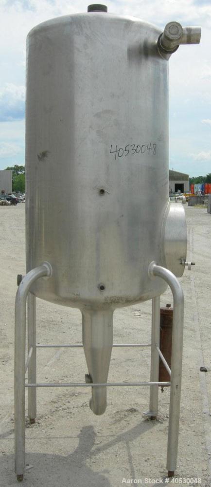 Used Creamery Package Tank, 250 gallon, 304 stainless steel, vertical. Approximately 36" diameter x 53" straight side, dished top and bottom. Openings: top (3) 2", 4"; side 2", 4"; 19" manway, no cov...