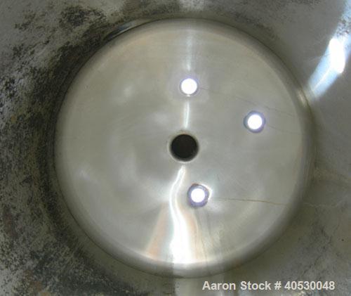 Used Creamery Package Tank, 250 gallon, 304 stainless steel, vertical. Approximately 36" diameter x 53" straight side, dished top and bottom. Openings: top (3) 2", 4"; side 2", 4"; 19" manway, no cov...