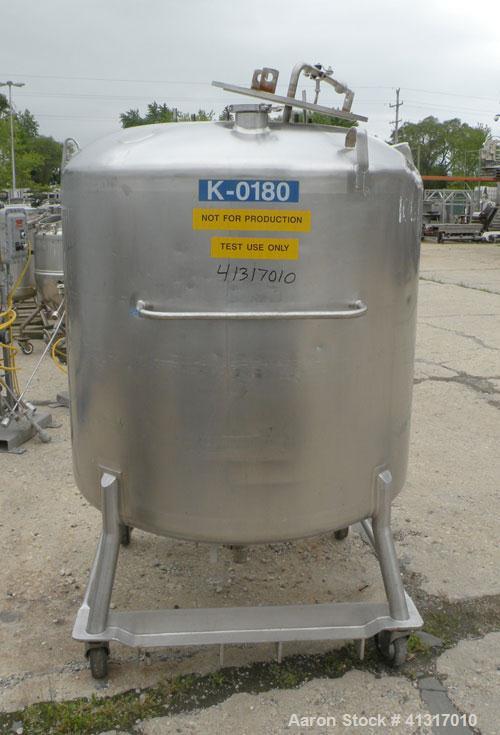 Used DCI Pressure Tank, 211 Gallon, 316 Stainless Steel, Vertical. 43 1/4" diameter x 37" straight side, dished top and bottom. 180 grit finished internal rated 50 psi at 300 deg.f.. Insulated with 2...