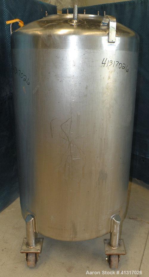 Used DCI Pressure Tank, 150 Gallon, 316L Stainless Steel, Vertical. 30" diameter x 44" straight side. Dish top and bottom. Internal rated 25 psi at 200 deg F. Openings: top  12" manway, no cover, (2)...