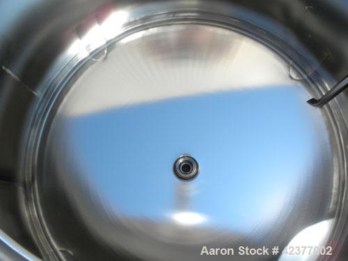 Used DCI Pressure Tank, 184 Gallon, 316L stainless steel, vertical. 41-3/4" Diameter x 26" straight side, dish top and bottom. Internal rated +35/-15 psi @ 284 degrees F. Internal CIP spray ball. Ope...
