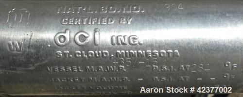 Used DCI Pressure Tank, 184 Gallon, 316L stainless steel, vertical. 41-3/4" Diameter x 26" straight side, dish top and bottom. Internal rated +35/-15 psi @ 284 degrees F. Internal CIP spray ball. Ope...