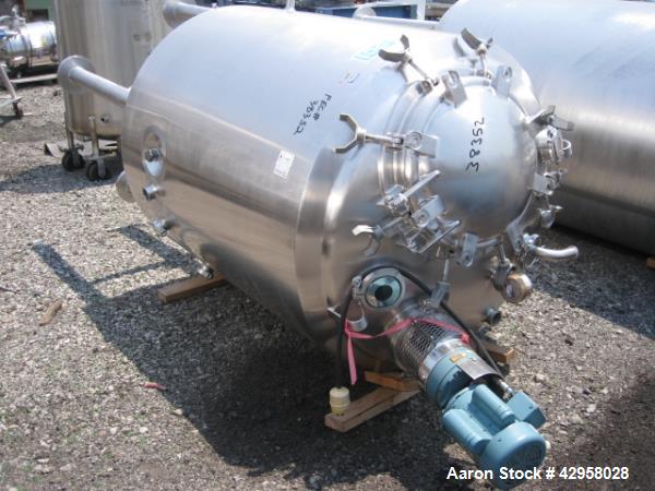 Used DCI tank, 1000 liters (250 gallons) 316L stainless steel constrution, approx. 42" diameter x 36" straight side, dished top and bottom with top entering .5 hp, 15/230 volt Lightnin agitator drive...