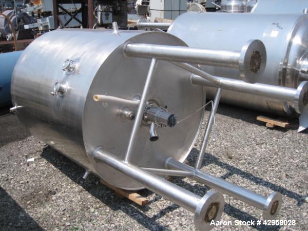 Used DCI tank, 1000 liters (250 gallons) 316L stainless steel constrution, approx. 42" diameter x 36" straight side, dished top and bottom with top entering .5 hp, 15/230 volt Lightnin agitator drive...
