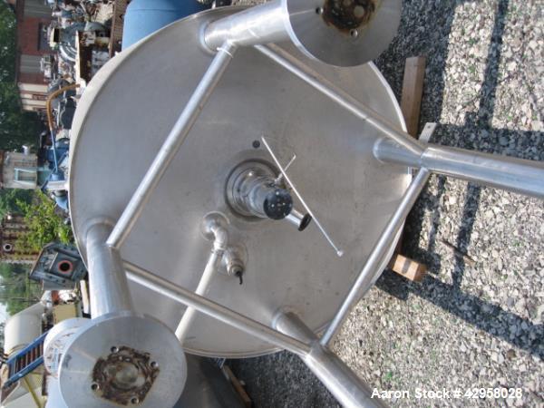 Used DCI tank, 1000 liters (250 gallons) 316L stainless steel constrution, approx. 42" diameter x 36" straight side, dished top and bottom with top entering .5 hp, 15/230 volt Lightnin agitator drive...