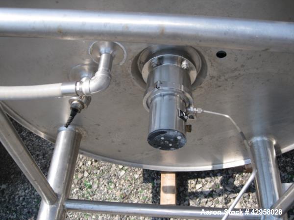 Used DCI tank, 1000 liters (250 gallons) 316L stainless steel constrution, approx. 42" diameter x 36" straight side, dished top and bottom with top entering .5 hp, 15/230 volt Lightnin agitator drive...
