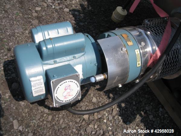 Used DCI tank, 1000 liters (250 gallons) 316L stainless steel constrution, approx. 42" diameter x 36" straight side, dished top and bottom with top entering .5 hp, 15/230 volt Lightnin agitator drive...