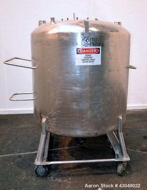 Used DCI Pressure Tank, 211.34 Gallon, 316 Stainless Steel, Vertical. 43-1/4’’ Diameter x 37’’ straight side, dished top and bottom. Internal rated 50 psi at 300 degrees F. Openings: top 16’’ manway,...