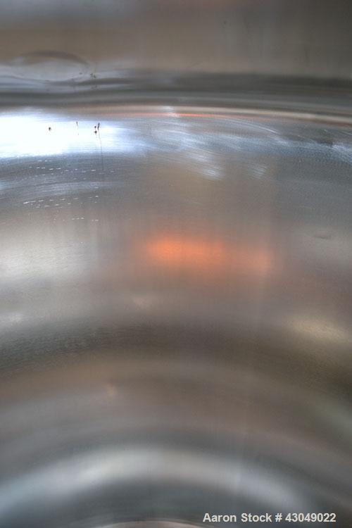 Used DCI Pressure Tank, 211.34 Gallon, 316 Stainless Steel, Vertical. 43-1/4’’ Diameter x 37’’ straight side, dished top and bottom. Internal rated 50 psi at 300 degrees F. Openings: top 16’’ manway,...