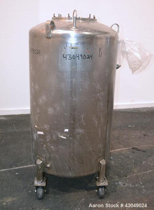 Used DCI Pressure Tank, 150 Gallon, 316L Stainless Steel, Vertical. 30’’ Diameter x 44’’ straight side, dished top and bottom. Internal rated 25 psi at 200 degrees F. Openings: top 12’’ manway with c...