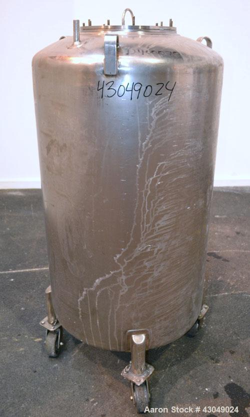Used DCI Pressure Tank, 150 Gallon, 316L Stainless Steel, Vertical. 30’’ Diameter x 44’’ straight side, dished top and bottom. Internal rated 25 psi at 200 degrees F. Openings: top 12’’ manway with c...