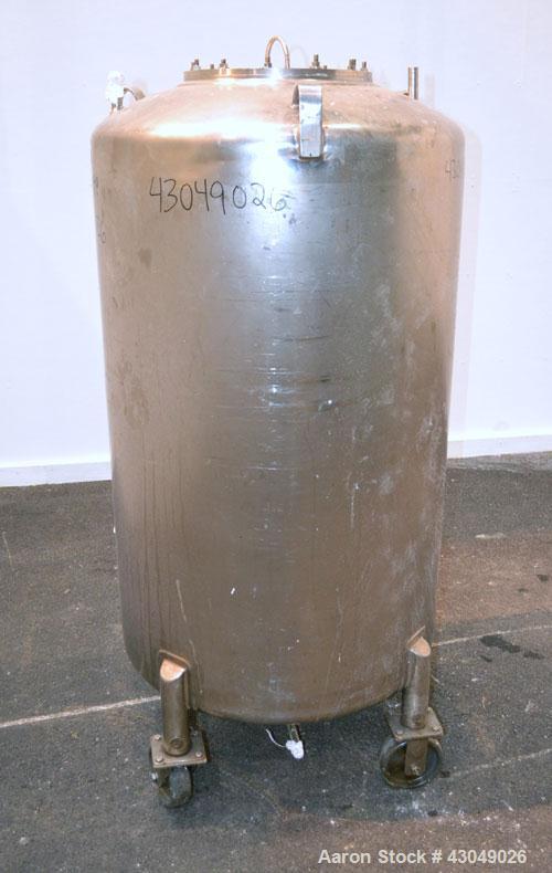 Used DCI Pressure Tank, 150 Gallon, 316L Stainless Steel, Vertical. 30’’ Diameter x 44’’ straight side, dished top and bottom. Internal rated 25 psi at 200 degrees F. Openings: top 12’’ manway with c...