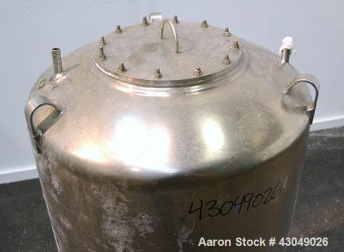 Used DCI Pressure Tank, 150 Gallon, 316L Stainless Steel, Vertical. 30’’ Diameter x 44’’ straight side, dished top and bottom. Internal rated 25 psi at 200 degrees F. Openings: top 12’’ manway with c...