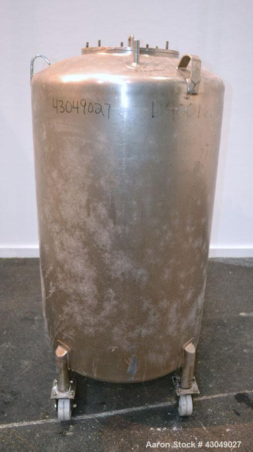 Used DCI Pressure Tank, 150 Gallon, 316L Stainless Steel, Vertical. 30’’ Diameter x 44’’ straight side, dished top and bottom. Internal rated 25 psi at 200 degrees F. Openings: top 12’’ manway with c...